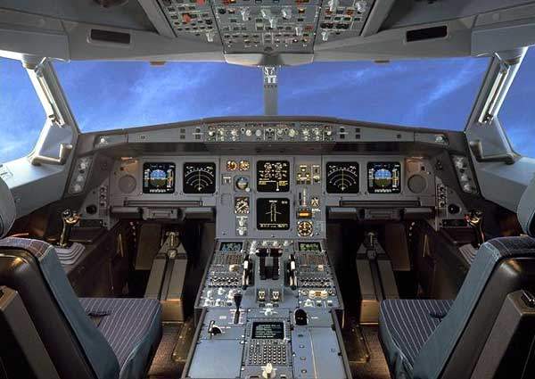 The cockpit of the A330. Fly-by-wire controls mean the pilot and co-pilot have sidestick controllers and rudder pedals.