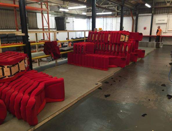 red chairs in a factory